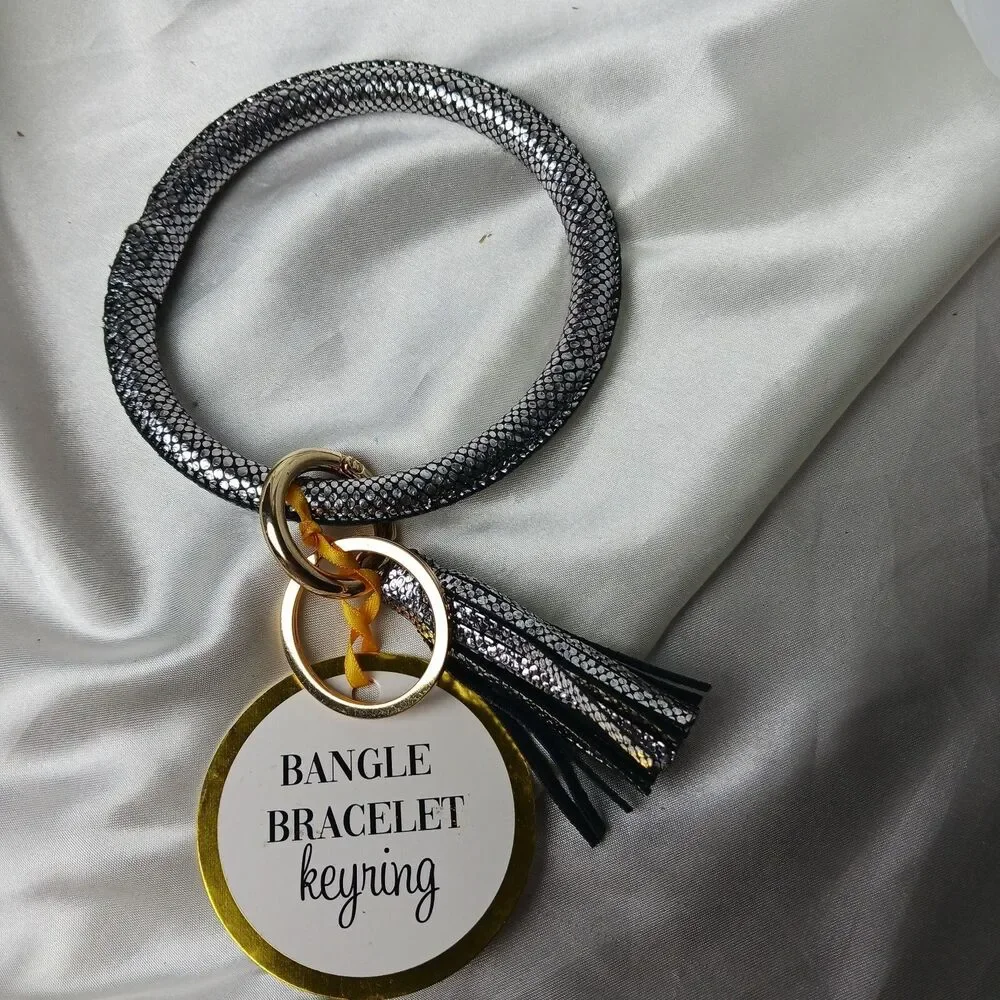 SILVER COLORED BRACELET KEYCHAIN WITH TASSEL
